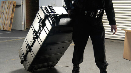 Peli 1780RF Rifle Case - Being pulled while rolling on its edge castor wheels